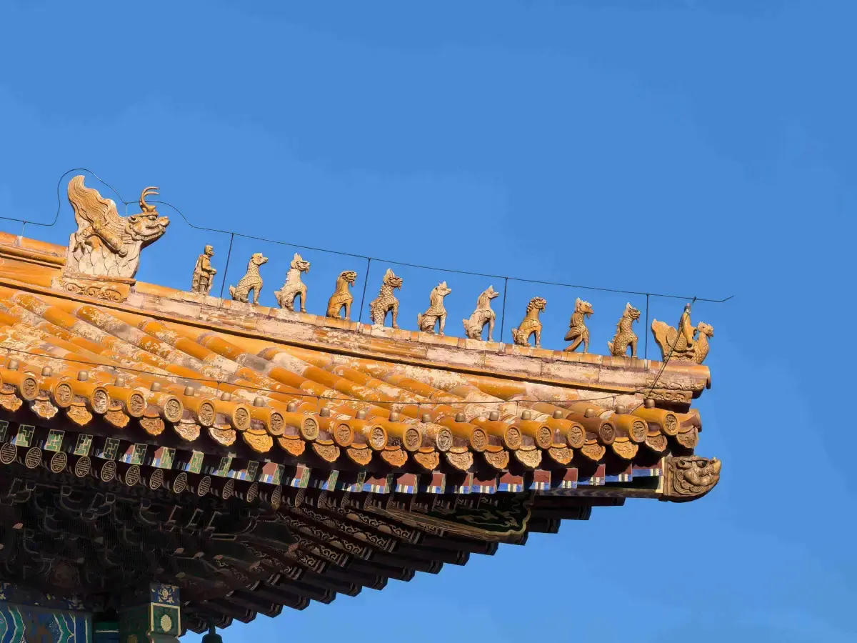 Golden glazed roof eaves with imperial ridge beasts at the Palace Museum