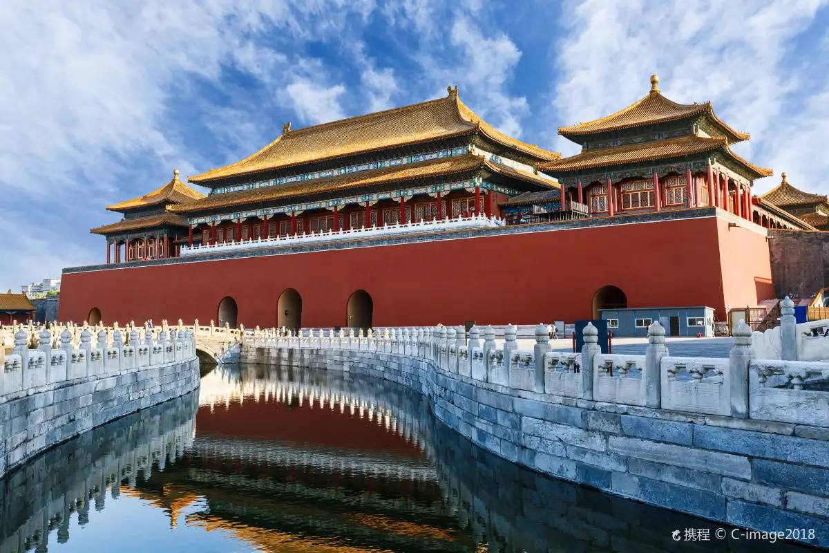 The Meridian Gate and palace moat under a blue sky