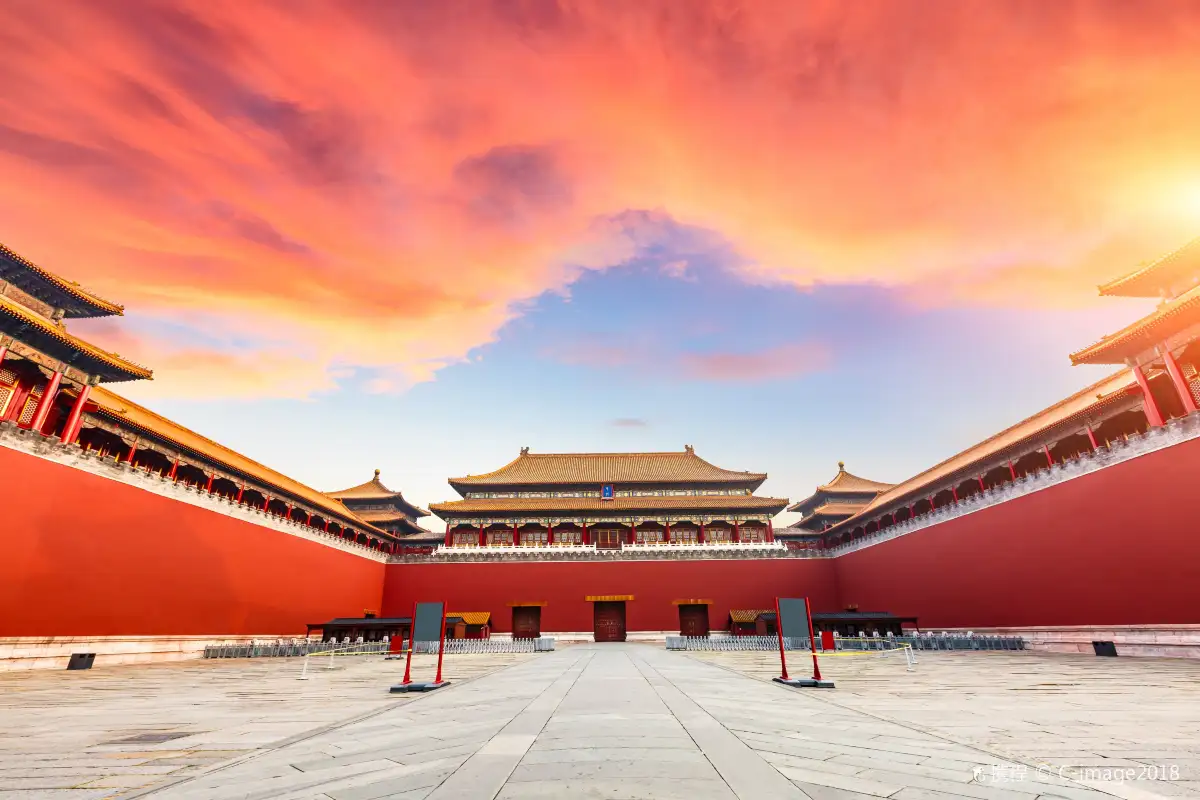 Red-walled courtyard of the Palace Museum at dusk